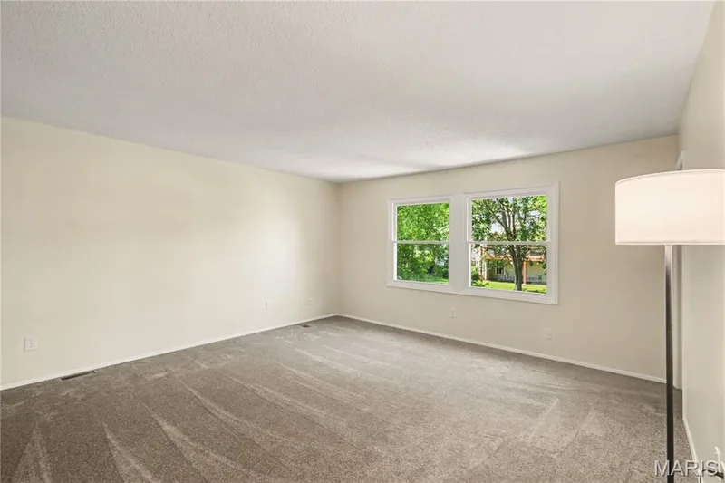 Primary bedroom w/2 walk-in closets and new carpet — 22 Normandy Drive, Lake St. Louis, MO 63367