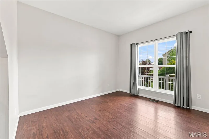 See the virtually staged picture for your imaginiation - Home Office or Living Room located in the front of the home off of the entry foyer. — 104 Towergate Drive, Lake St. Louis, MO 63367