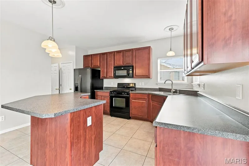 Large Kitchen Island for additional seating! — 104 Towergate Drive, Lake St. Louis, MO 63367