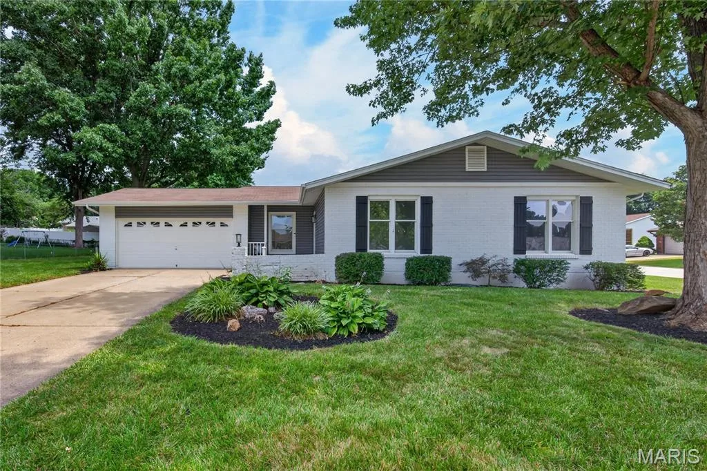 Front Elevation with Brick, Vinyl Siding and Oversized Two Car Garage — 608 Mosport Drive, St Charles, MO 63304