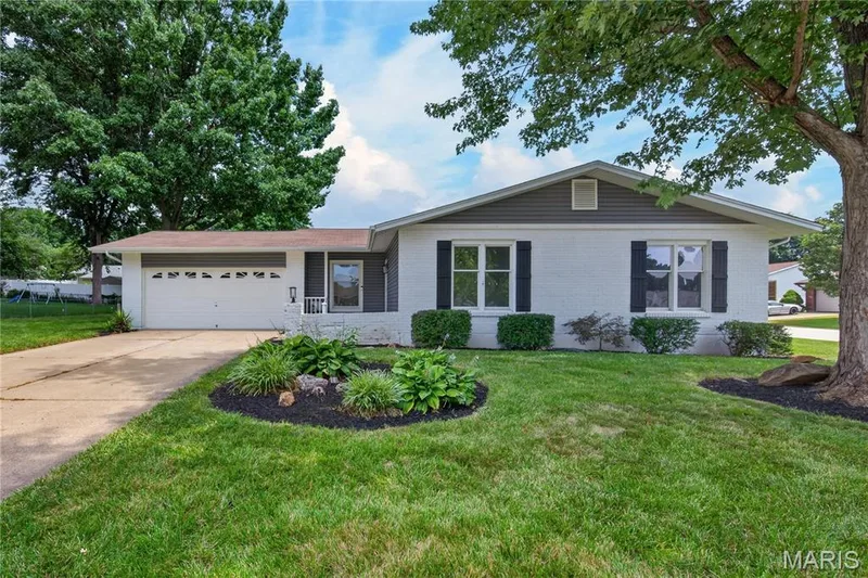 Front Elevation with Brick, Vinyl Siding and Oversized Two Car Garage — 608 Mosport Drive, St Charles, MO 63304
