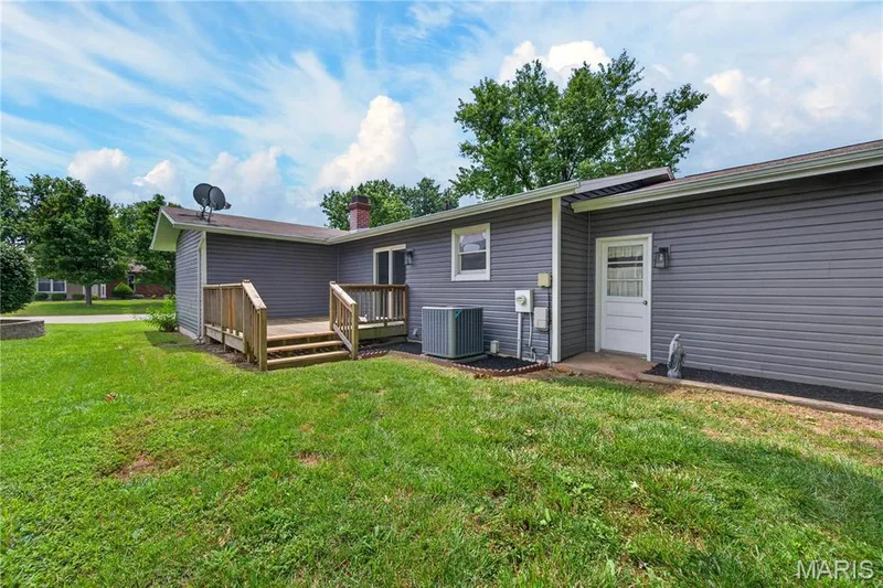 Level Backyard with Deck and Garage Service Door — 608 Mosport Drive, St Charles, MO 63304