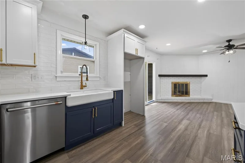 Kitchen with Stainless Steel Appliances, Quartz Countertops, Tile Backsplash and Updated Lighting — 608 Mosport Drive, St Charles, MO 63304
