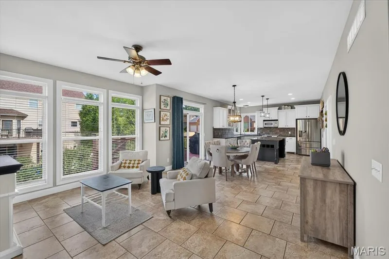 A long view of the Kitchen, with Hearth and Breakfast Room leading to the Kitchen area.  Perfect for entertaining or family gatherings! — 31 Pinewood Court, Dardenne Prairie, MO 63368