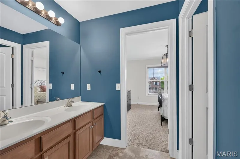 The Jack and Jill bathroom connecting bedrooms 2 and 3. — 31 Pinewood Court, Dardenne Prairie, MO 63368