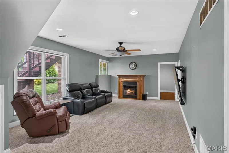 The Lower Level Family Room with gas fireplace and window to back yard. — 31 Pinewood Court, Dardenne Prairie, MO 63368