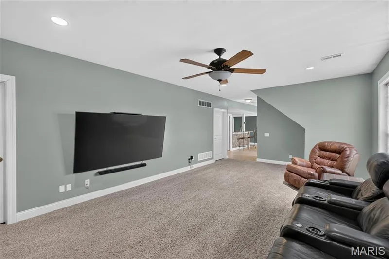The Lower Level Family Room with large wall mount for TV. — 31 Pinewood Court, Dardenne Prairie, MO 63368