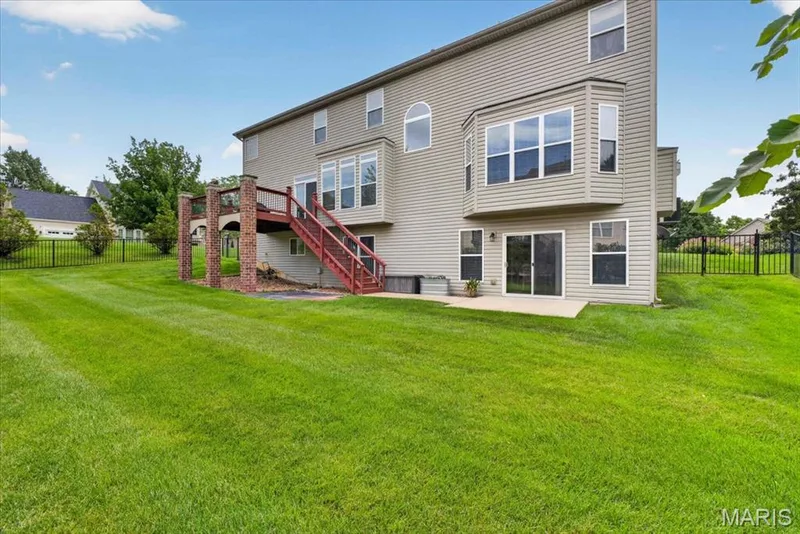 The back of the home showing the walkout and patio. — 31 Pinewood Court, Dardenne Prairie, MO 63368