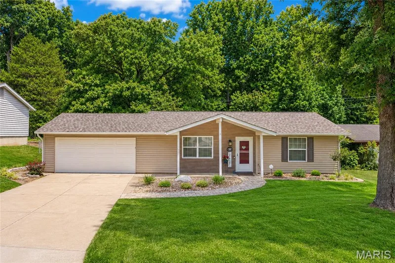 Ranch-style residence featuring tan siding and a covered front entry — 802 Barbara Place, O'Fallon, MO 63366