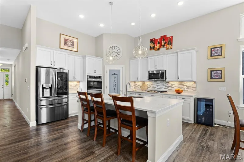 Adjoining great room keeps everyone connected. — 1316 Silver Fern Drive, Lake St. Louis, MO 63367