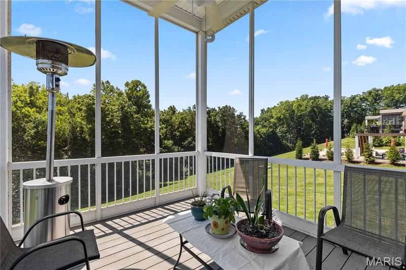 The screened porch overlooks the 35 peaceful acres of Deer Ridge Nature Park adjoining the back yard. — 1316 Silver Fern Drive, Lake St. Louis, MO 63367