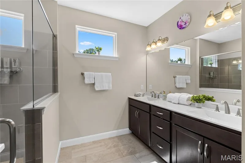 Primary suite bathroom with a dual vanity. — 1316 Silver Fern Drive, Lake St. Louis, MO 63367