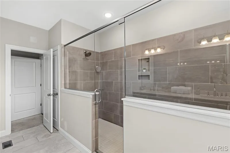 Relax and recharge in the primary ensuite dual walk-in shower. — 1316 Silver Fern Drive, Lake St. Louis, MO 63367