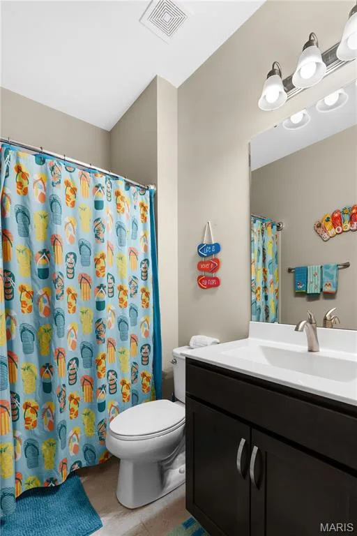 The bedrooms share a full hall bathroom. — 1316 Silver Fern Drive, Lake St. Louis, MO 63367