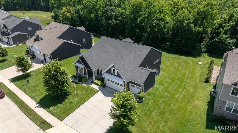 The nature park provides a peaceful natural backdrop with no future development behind the property. — 1316 Silver Fern Drive, Lake St. Louis, MO 63367