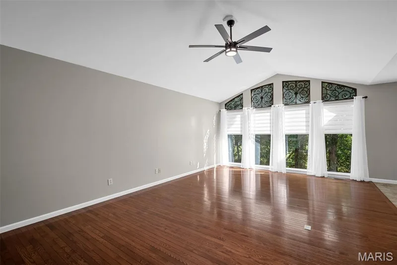 Stunning palladium wall of windows overlooking trees/golf course. — 3416 Sun Bear Court #830C, Wentzville, MO 63385