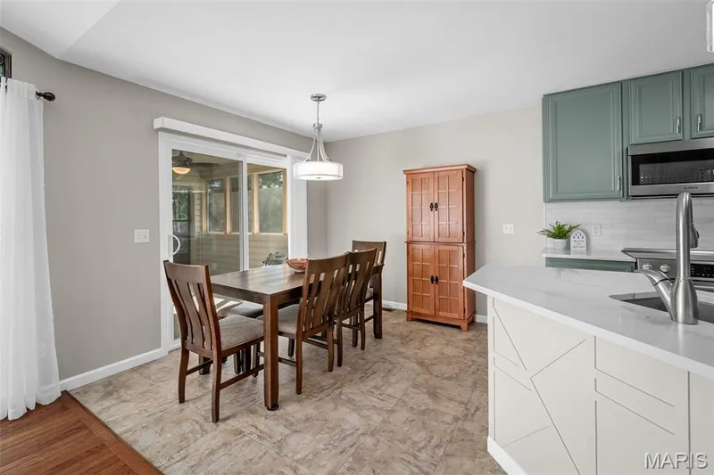 Breakfast room with slider to 9 x 12 screened in sunroom/deck with stairs to landing. — 3416 Sun Bear Court #830C, Wentzville, MO 63385
