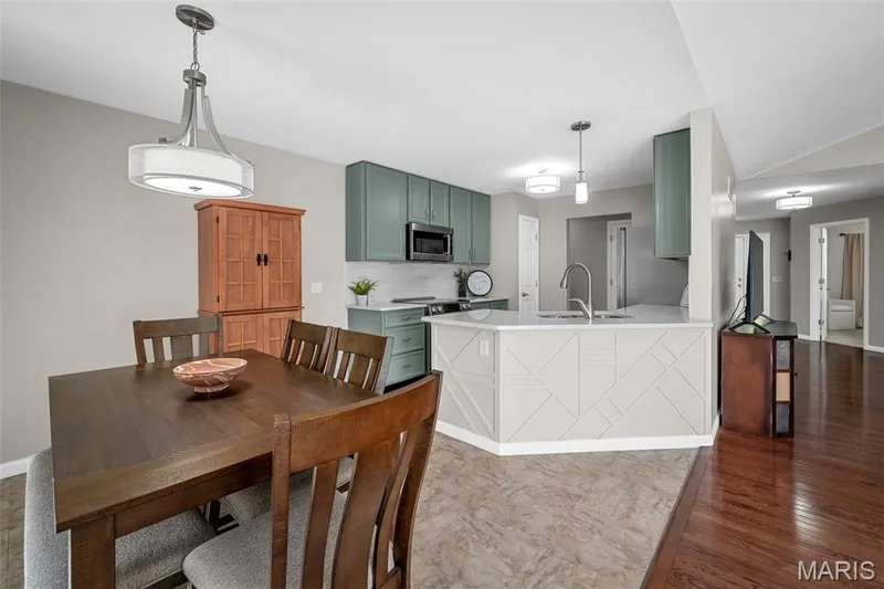 Breakfast room with updated lighting. — 3416 Sun Bear Court #830C, Wentzville, MO 63385