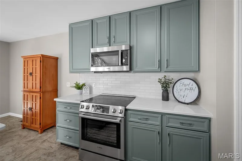 Another view of the gorgeous, updated kitchen and ss Bosch appliances. — 3416 Sun Bear Court #830C, Wentzville, MO 63385