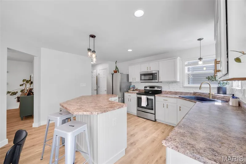Loads of cabinets in this kitchen — 202 Wyndtrace Court, Lake St. Louis, MO 63367