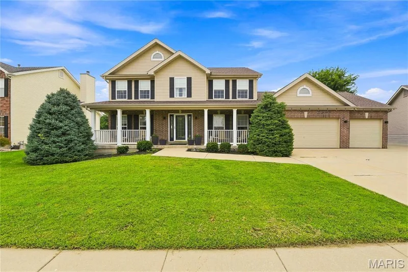 Inviting two-story home with a three-car garage — 539 Sunshine Brook Drive, Wentzville, MO 63385