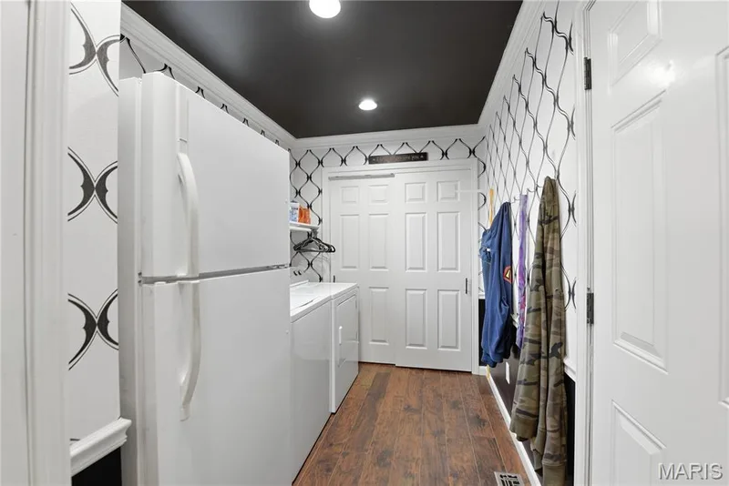 Convenient laundry room with ample storage — 539 Sunshine Brook Drive, Wentzville, MO 63385