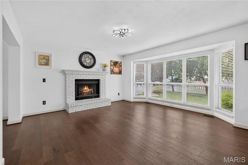 Spacious Family Room with fireplace, wood floors — 215 Waterford Crossing Drive, Dardenne Prairie, MO 63368