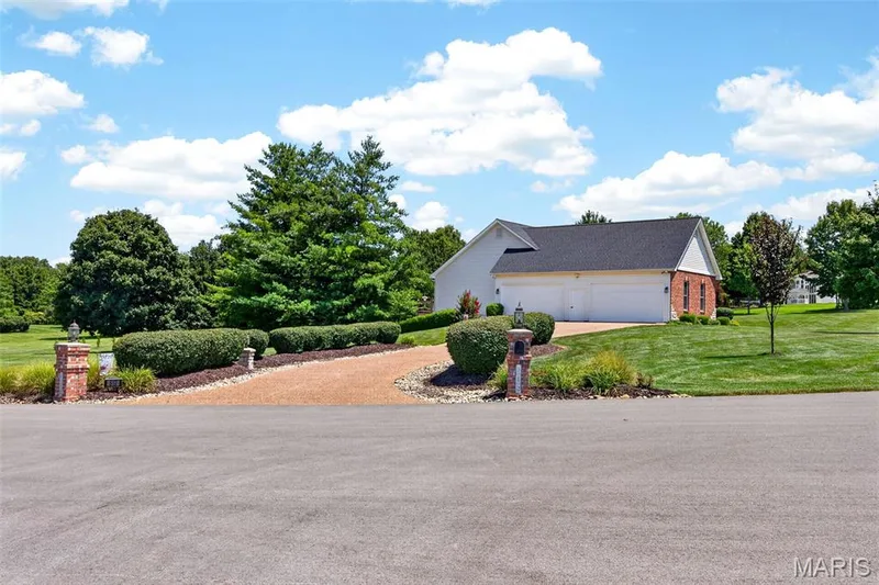 Side Car Entry w/ 4     F-O-U-R   Car GARAGE & Aggregate Driveway!! — 512 Meadowfield Lane, Wentzville, MO 63385