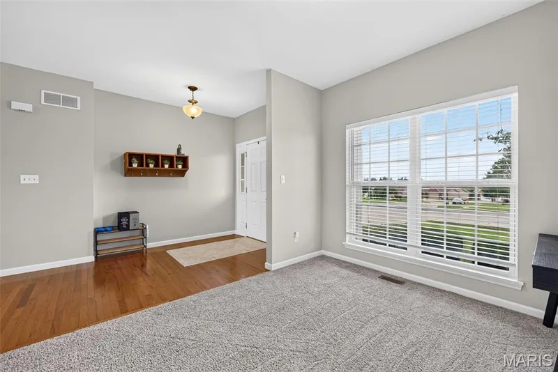 living room with ample natural lighting — 743 Springfield Drive, Wentzville, MO 63385