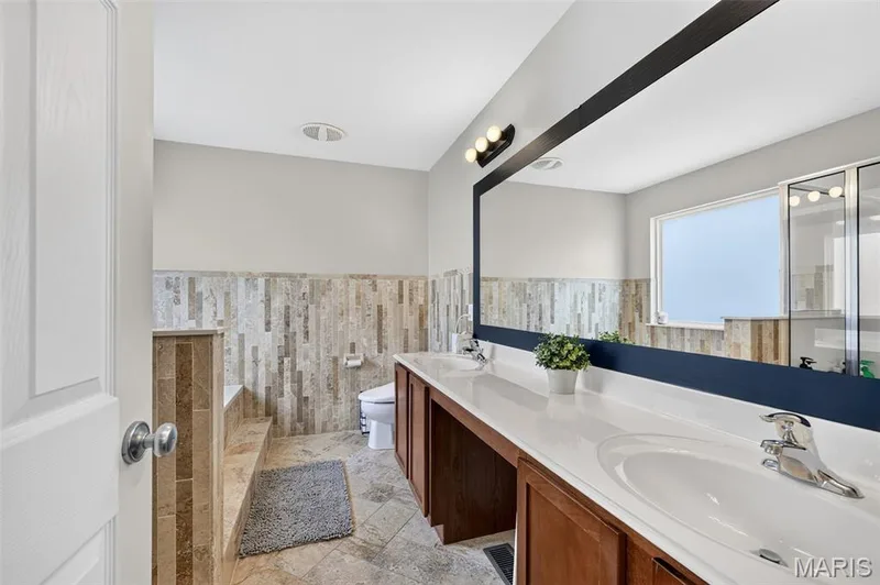 Primary en suite bathroom with dual sinks — 743 Springfield Drive, Wentzville, MO 63385