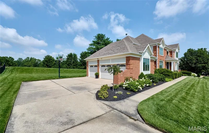 Three-car side-entry garage with large parking pad. — 2323 Wellington Estates Drive, Chesterfield, MO 63017