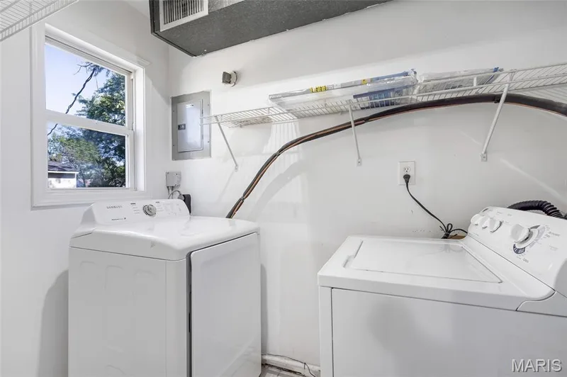 Single-hung window with exterior exposure and installed wire shelving — 503 Eggering Drive, O'Fallon, MO 63366