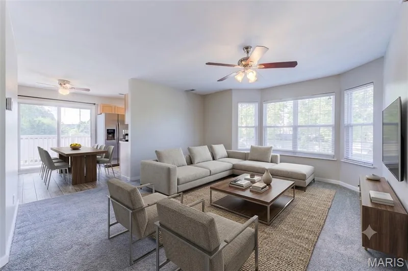 Staged living and dining to show space and size of areas.  Lots of natural lighting in these areas. — 480 Benton Drive #F, St Peters, MO 63376
