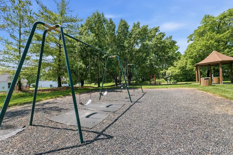 Outdoor recreational space featuring a swing set and a wooden gazebo — 480 Benton Drive #F, St Peters, MO 63376