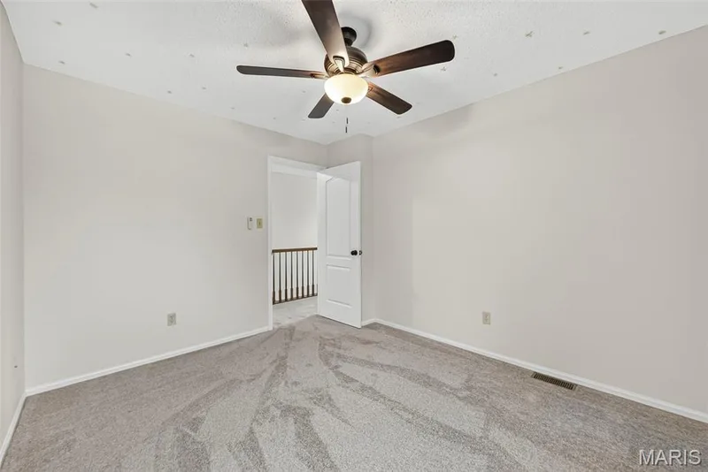 Neutral wall paint with baseboard trim — 4014 Treeshadow Drive, St Peters, MO 63376