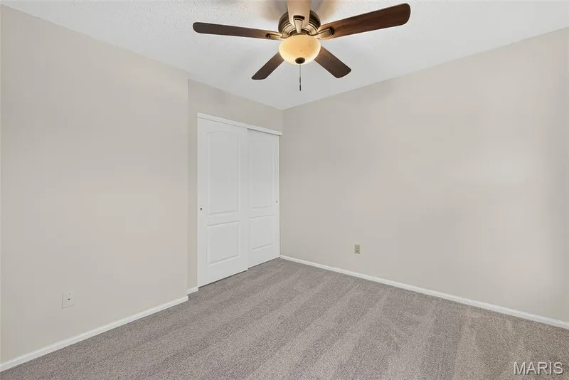 Neutral-toned walls and grey carpet flooring — 4014 Treeshadow Drive, St Peters, MO 63376