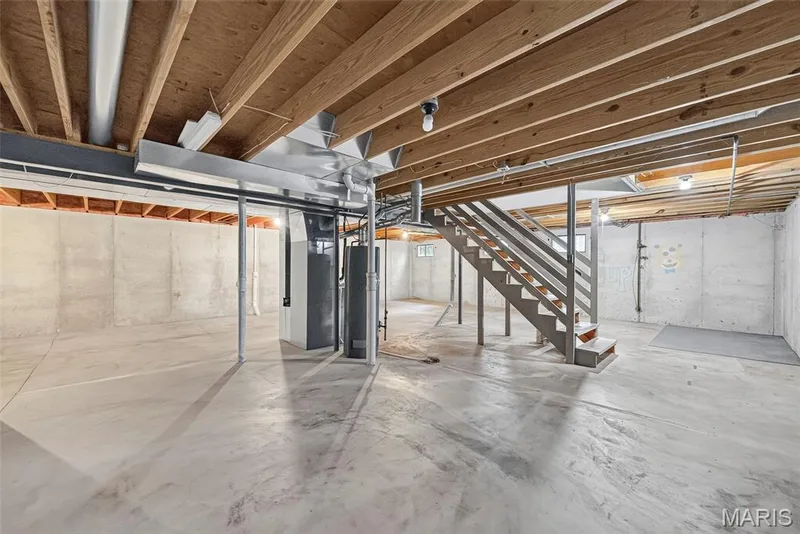 Unfinished basement offering expansive concrete flooring — 4014 Treeshadow Drive, St Peters, MO 63376