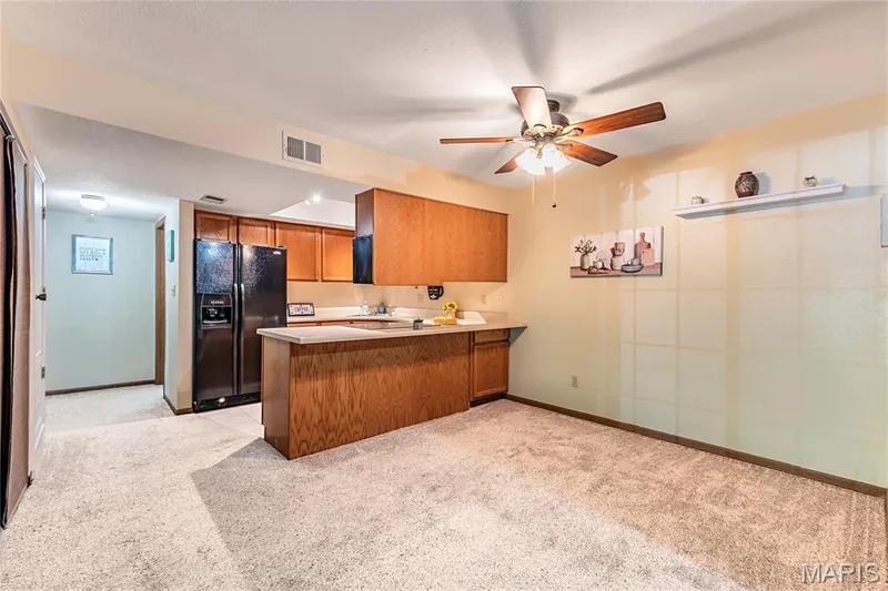 Dining area off the kitchen makes entertaining fun. — 1440 Heritage Landing #105, St Charles, MO 63303