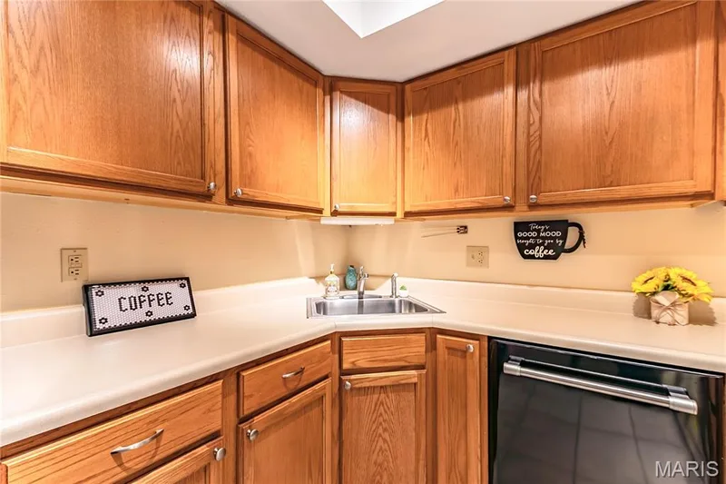 The functional kitchen offers abundant cabinet and counter space. — 1440 Heritage Landing #105, St Charles, MO 63303
