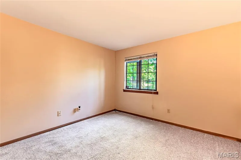 Bedroom number one gives your guests a comfy place to stay. — 1440 Heritage Landing #105, St Charles, MO 63303