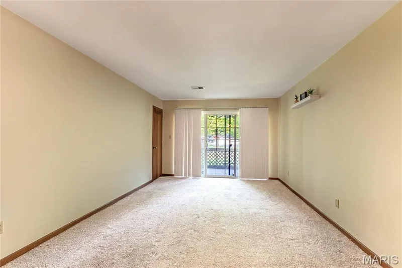 The primary bedroom also opens to a private screened porch, offering another quiet spot to relax. — 1440 Heritage Landing #105, St Charles, MO 63303