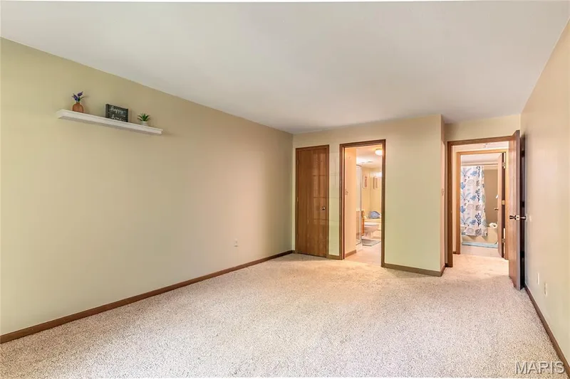 The primary bedroom features 2 closets and a 3rd in the ensuite bathroom. — 1440 Heritage Landing #105, St Charles, MO 63303