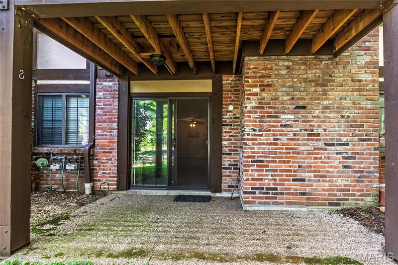 Enjoy peaceful pond views from the patio just off the living room—perfect for morning coffee, duck-watching, or unwinding at the end of the day. — 1440 Heritage Landing #105, St Charles, MO 63303