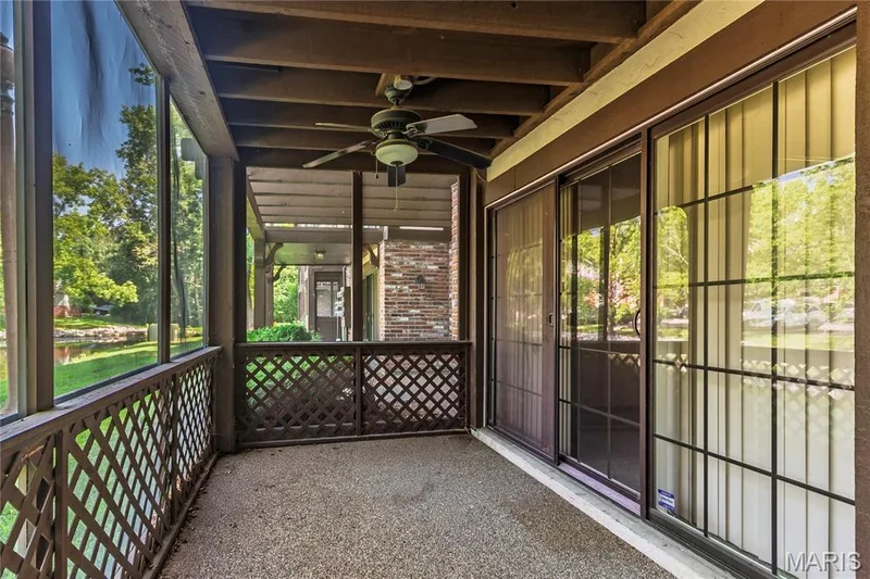 Screened patio off primary bedroom  extends your living space during warm weather — 1440 Heritage Landing #105, St Charles, MO 63303