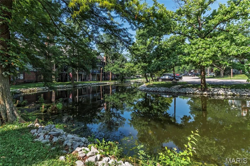 1440 Heritage Landing #105 features a tranquil pond setting behind the unit. — 1440 Heritage Landing #105, St Charles, MO 63303