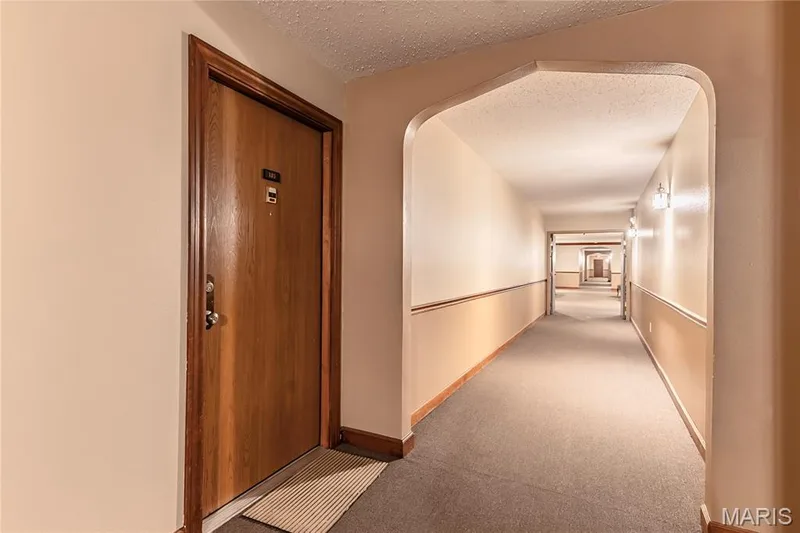 Arched entryway leads to unit 105 — 1440 Heritage Landing #105, St Charles, MO 63303
