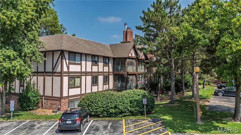 Tudor-style buildings  create a charming atmosphere — 1440 Heritage Landing #105, St Charles, MO 63303