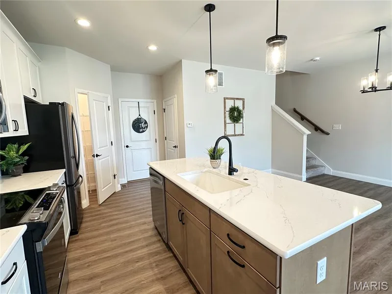 Kitchen With Solid Surface Counters, Soft Close Cabinets, Deluxe Lighting Package, & Refrigerator — 2810 McClay Road, St Charles, MO 63303