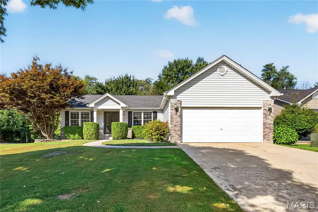 Impressive Ranch with Brick, Vinyl Siding, Covered Front Porch. Professional Landscaping and Two Car Garage — 167 Rightfield Drive, O'Fallon, MO 63366