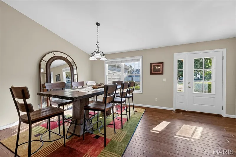 Dining Room and Entry Foyer with Vaulted Ceilings and Wood Flooring — 167 Rightfield Drive, O'Fallon, MO 63366
